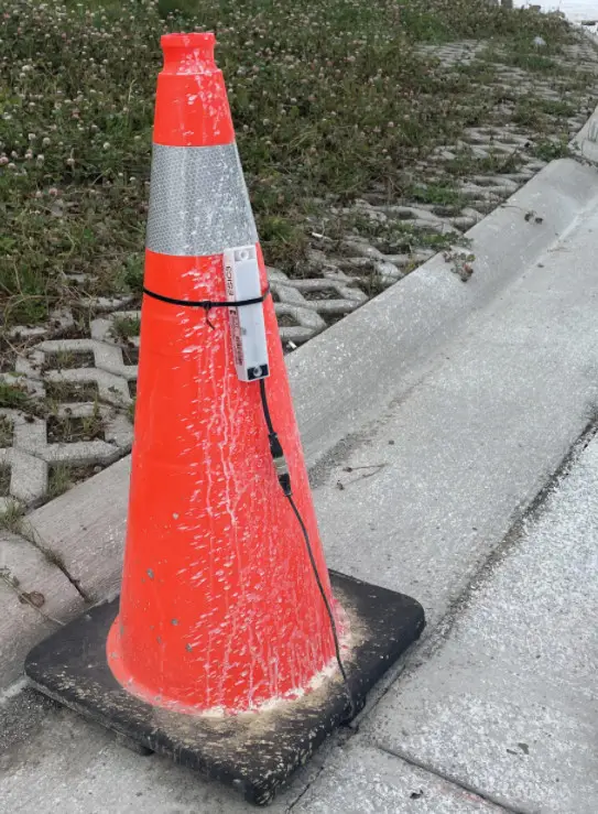 Wireless temperature logger deployed on a traffic cone at a placement